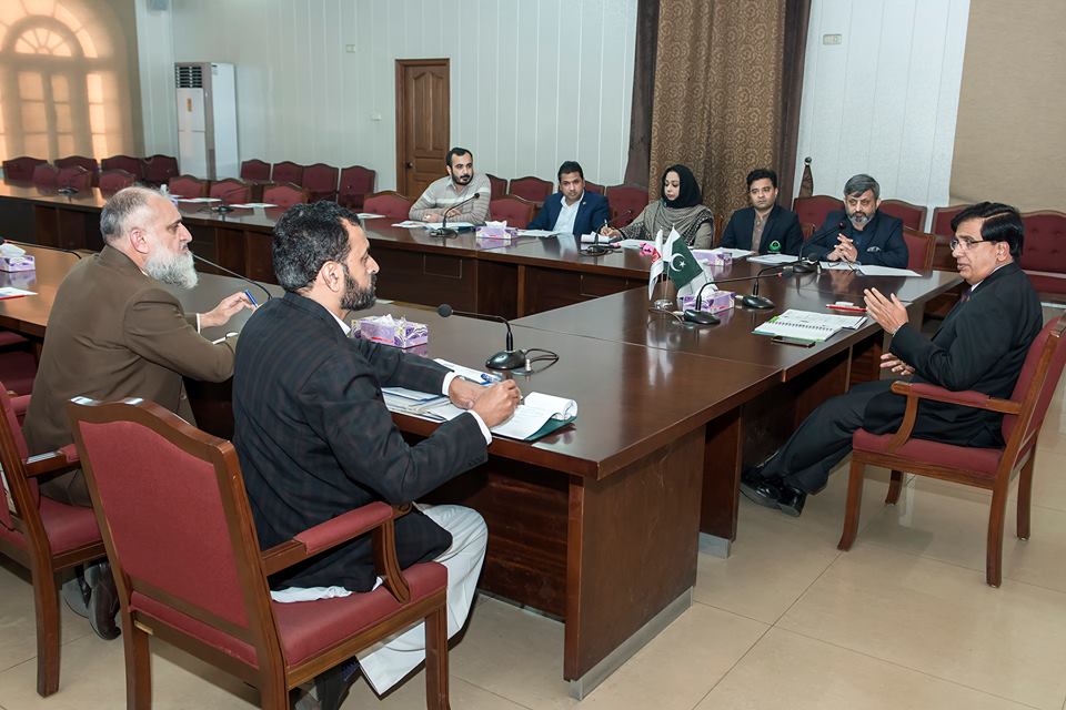 Prof Talat Naseer Pasha chairing a meeting